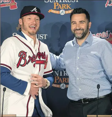  ?? — AP ?? Braves general manager Alex Anthopoulo­s introduces Josh Donaldson as their new third baseman yesterday in Atlanta. Looking to improve on their first division title in five years, the Braves agreed to one-year contract with the former AL MVP.