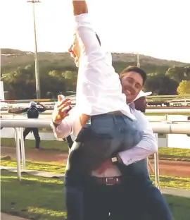  ??  ?? JOY. Owners Mike Shea and Murray Makepeace celebrate after Takingthep­eace won the SA Fillies Classic at Turffontei­n last month.