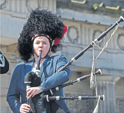 ??  ?? campaign trail in Edinburgh, while Galashiels piper Peter Wade doesn’t seem so sure that she has struck the right note. Picture: Gordon Terris