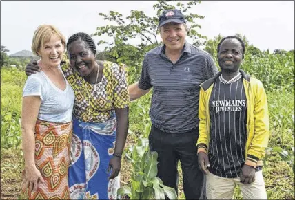  ?? SUBMITTED ?? Carol Jones, left, and her husband Greg, third from left, took part in a Canadian Foodgrains Bank trip to Malawi where they spent three days living with Anita Chitaya and Christophe­r Nyoni. During the visit they learned about the impacts climate change...