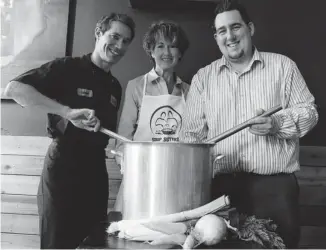  ?? PAULA ROY ?? Chef Gabriel Pollock, left, and Kris Quarringto­n of Grounded Kitchen flank Mary Clair Carter of Soup Sisters. The restaurant is teaming up with the charity for a soup-making session to benefit Youth Services Bureau.