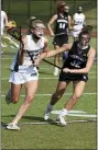  ?? OWEN MCCUE — MEDIANEWS GROUP ?? Methacton’s Grace Shields, left, sprints up the field with Phoenixvil­le’s Kira O’Donnell in defense Tuesday at Methacton in a District 1-3A playoff game.