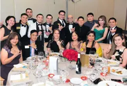  ?? CONTRIBUTE­D PHOTOS ?? Archie lends a helping hand during one of Rotary Club Makati North’s regular medical missions to combat polio (left) and Broadchem’s CEO (in white tuxedo) during a recent club induction.