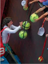  ?? Reuters ?? Carla Suarez Navarro signs autographs after winning against Anett Kontaveit on Sunday. —