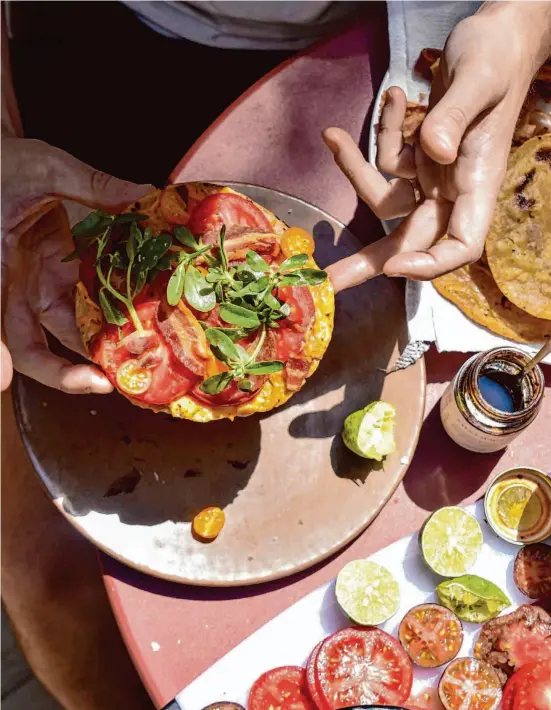  ?? Christian Reynoso/Special to The Chronicle ?? Easy-to-make BLT Tostadas With Salsa Macha Mayo transforms the classic sandwich into a summery meal that tastes fresh and new.
