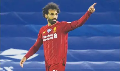  ?? Picture: AFP ?? GOAL GLUTTON. Liverpool’s Mohamed Salah celebrates after scoring their third goal during their English Premier League match against Brighton at the Amex Community Stadium on Wednesday night.