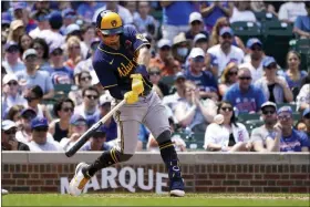  ?? CHARLES REX ARBOGAST/THE ASSOCIATED PRESS ?? Milwaukee Brewers’ Luis Urias connects for a three-run homer against the Chicago Cubs in the seventh inning of Monday’s opening game of a doublehead­er in Chicago.