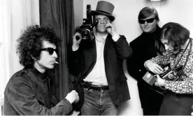  ??  ?? DA Pennebaker (in the hat) with Bob Dylan, left, filming Don’t Look Back, 1965. Photograph: Michael Ochs Archives