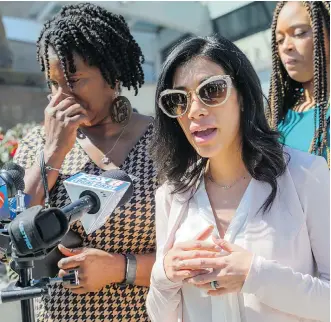  ?? MATTHEW HINTON/THE ASSOCIATED PRESS ?? Jennifer McKnight, left, the mother of former NFL and CFL running back Joe McKnight, contains her emotions as Michelle Beltran Quick, the mother of McKnight’s son Jaiden McKnight, speaks about the sentencing of Ronald Gasser for the 2016 road rage...