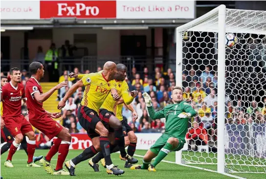  ??  ?? Reds rocked: Watford’s Stefano Okaka (centre) scoring the first goal past Liverpool goalkeeper Simon Mignolet in the English Premier League match on Aug 12. The game ended 3-3. Below: Scotland defender Andrew Robertson has yet to feature in a...