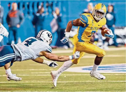  ?? Marcio Jose Sanchez / Associated Press ?? The Texans selected San Jose State’s versatile running back Tyler Ervin, right, in the fourth round of the draft to give a much-needed boost to a running game that has often lacked breakaway speed in recent years.
