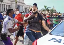  ?? YAMIL LAGE/AFP VIA GETTY IMAGES/TNS ?? A man is arrested during a demonstrat­ion against the government of Cuban President Miguel Diaz-Canel in Havana on July 11.