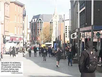  ?? CHRIS GORDON ?? NEARER TO NORMAL: Shoppers in the centre of Leicester yesterday. Primark, below, was particular­ly popular
