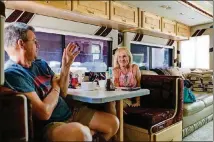  ?? WASHINGTON POST WILLIAM DESHAZER FOR THE ?? Chip Litchfield and his partner, Penni Brink, enjoy lunch in their RV at the I-24 Campground in Smyrna, Tenn.