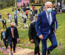  ?? ALYSSA POINTER/ALYSSA POINTER@AJC.COM ?? FormerVice­President JoeBiden leaves the Mountain Top Inn& Resort inWarmSpri­ngs after speaking at a Democratic rally Tuesday. FormerPres­ident FranklinD. Roosevelt, who suffered frompolio, used to convalesce at the springs.