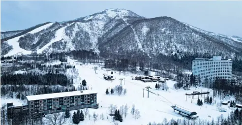  ??  ?? Below: at 1,898m, Mount Yotei has the longest vertical ski descent in Hokkaido.