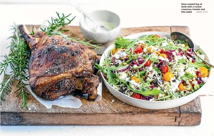  ?? SARAH TUCK ?? Slow-roasted leg of lamb with a rocket, couscous, tomato and feta salad.