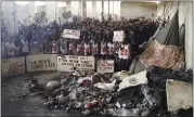  ?? THE ASSOCIATED PRESS ?? Migrants in May stage a protest in a detention center in the town of Zintan, western Libya, appealing for help from the United Nations.