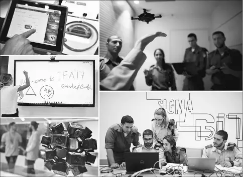  ??  ?? (Clockwise from top right) An Israeli soldier places his hand under a mini drone as he takes part in a cyber security training course, called a Hackathon, at iNT Institute of Technology and Innovation, at a high-tech park in Beersheba, southern Israel....