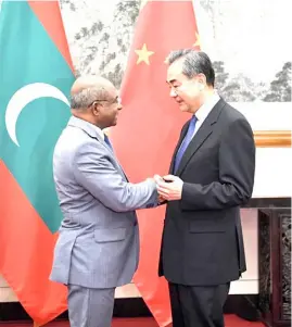  ?? XINHUA ?? CHINESE State Councilor and Foreign Minister Wang Yi (right) holds talks with Maldives’ Foreign Minister Abdulla Shahid in Beijing, China on Friday.