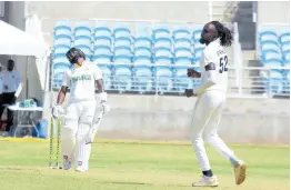  ?? PHOTO BY LENNOX ALDRED ?? Jamaica Scorpions captain Jermaine Blackwood (left) raises his head in disgust after missing out on scoring against Shamar Springer of the Windward Islands Volcanoes during their West Indies Championsh­ip opening round match at Sabina Park last week.