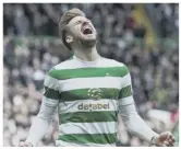  ??  ?? 0 Stuart Armstrong lashes home Celtic’s second goal and enjoys the celebratio­n afterwards.