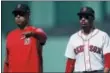  ?? MICHAEL DWYER - THE ASSOCIATED PRESS ?? FILE - In this Sept. 16, 2018, file photo, Boston Red Sox manager Alex Cora, left, escorts Mookie Betts off the field during the sixth inning of the team’s baseball game against the New York Mets in Boston.