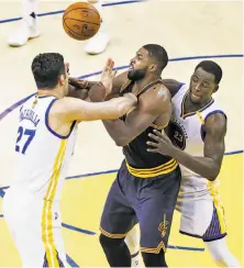  ?? Scott Strazzante / The Chronicle ?? The Warriors’ Zaza Pachulia knocks the ball away from Cavs center Tristan Thompson, who had zero points in 22 minutes.