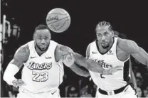  ?? RINGO H.W. CHIU AP ?? Kawhi Leonard (right) and the Clippers have gotten the best of Lebron James and the Lakers in their first two matchups.