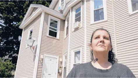 ?? STEVEN SENNE/AP ?? Roxanne Schaefer, of West Warwick, Rhode Island, shown outside her apartment building Tuesday, is $3,000 behind on rent after her girlfriend lost her job. She’s bracing for the end to a CDC federal moratorium Saturday.