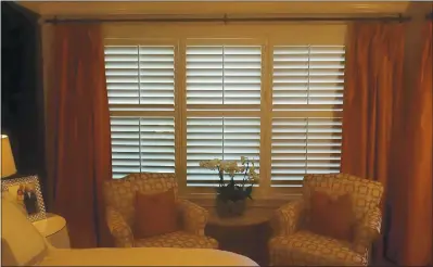  ?? PHOTO BY MARNI JAMESON ?? Louvered shutters are at home with almost every style of interior and in every room of the house, including this master bedroom.