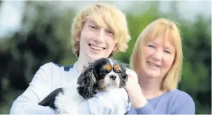  ?? Dominic Salter ?? ●● Chris pictured with mum Lindsey and dog Skye, who was also injured in the incident