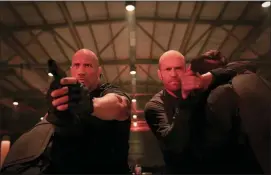  ?? DANIEL SMITH — UNIVERSAL PICTURES VIA AP ?? This image released by Universal Pictures shows Dwayne Johnson, left, and Jason Statham in a scene from “Fast & Furious Presents: Hobbs & Shaw.”