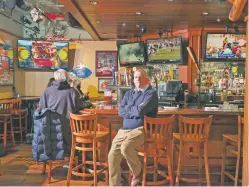  ?? PETER PRATO/NEW YORK TIMES ?? James Hutton sits in his business, Players Sports Grill & Arcade, on Thursday in San Francisco. Even though he submitted his grant applicatio­n just one minute after the Restaurant Revitaliza­tion Fund opened, his applicatio­n was eventually denied.