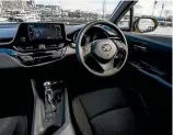  ??  ?? Recognisab­ly Toyota, but interior still has styling flair. Clunky operating system of tabletstyl­e screen is a letdown.