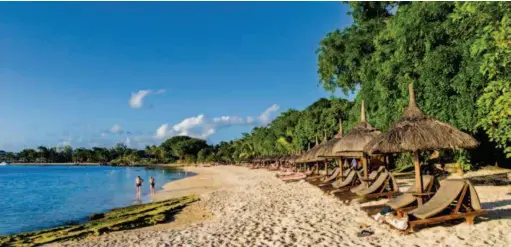  ??  ?? A beach near Tamarin Bay, Mauritius. Over the past 30 years, Mauritius has developed from a low-income economy based on agricultur­e to a middle-income diversifie­d economy. Much of its economic growth has been the result of the expansion of the luxury tourism sector. VCG