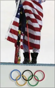  ?? GERO BRELOER - THE ASSOCIATED PRESS ?? FILE - In this Feb. 21, 2014file photo women’s slalom gold medal winner Mikaela Shiffrin of the United States poses for photograph­ers with the U.S. flag at the Sochi 2014 Winter Olympics in Krasnaya Polyana, Russia.