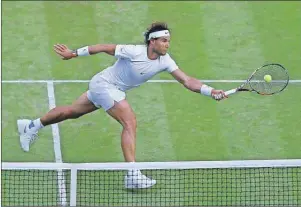  ?? AP PHOTO ?? Rafael Nadal of Spain returns a ball to Dustin Brown of Germany, during their singles match at the All England Lawn Tennis Championsh­ips in Wimbledon, London, Thursday.