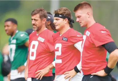 ?? MIKE STOBE/GETTY ?? Aaron Rodgers (8), Zach Wilson (2) and Tim Boyle, from Xavier High in Middletown, form a unique quarterbac­k story brewing with the Jets.