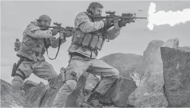  ?? DAVID JAMES ?? Geoff Stults as Sean Coffers and Chris Hemsworth as Captain Mitch Nelson in Danish photograph­er and first-time director Nicolai Fuglsig’s 12 Strong, which deals with the first U.S. Special Forces in Afghanista­n after 9/11.