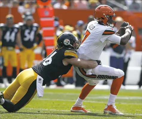 ?? Ron Schwane/Associated Press ?? Linebacker Anthony Chickillo drags down Cleveland Browns quarterbac­k DeShone Kizer Sunday in the first half. Chickillo was flagged for one of four unnecessar­y roughness penalties against the Browns and could be fined as a result.