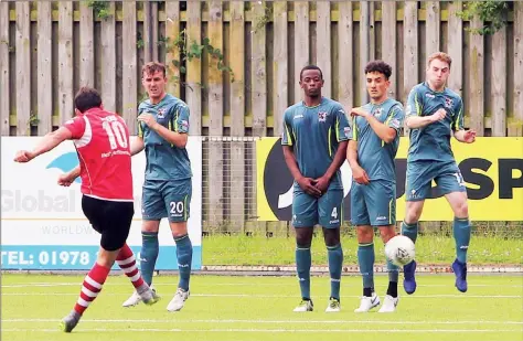  ??  ?? CALM BEFORE THE STORM . . . Zimbabwe internatio­nal defender Alec Mudimu (second from left) stands in the CEFN Druids wall during a practice match as they prepared for their Europa League battle against FK Trakai last Thursday