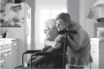  ?? Christina House/Los Angeles Times/TNS ?? ■ Margaret Wardlow, right, hugs her mother, Dolores McKeown, 97, on Sunday at their home in Cathedral City, Calif. Wardlow was the 27th and youngest victim of the East Area Rapist. She was 13 when he invaded her Sacramento home and violated her while...