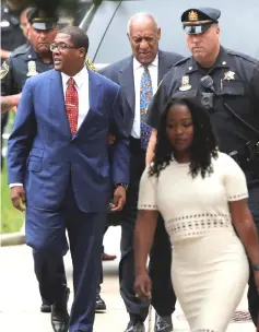  ?? — Reuters photo ?? Cosby arrives at the Montgomery County Courthouse for sentencing in his sexual assault trial, with his spokeman Wyatt (left), in Norristown, Pennsylvan­ia, on Monday.