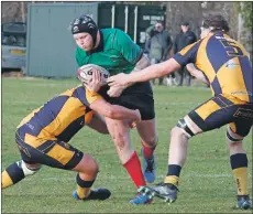  ??  ?? Crawford Brown barges his way through the Strathaven defence.