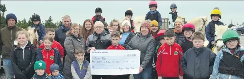  ?? (Pic: John Ahern) ?? €465 RAISED BY ARAGLEN PONY CLUB. Araglen Pony Club officers, Mary Leddy and Paula O’Donovan, presenting a cheque for €465 to John White, who accepted on behalf of ‘Mary’s Meals’. The presentati­on took place last Sunday at the Barranafad­dock Wind Farm, prior to a cross country hack - an event that was enjoyed by all.