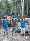  ??  ?? Workers suspected of illegal logging are detained for questionin­g by environmen­tal police in Para in October 2019.