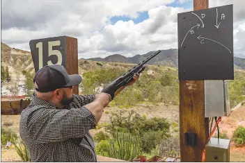  ?? Chris Torres/The Signal ?? Jasper Gonzalez aims his shotgun at the clay disc during Carousel Ranch’s 13th annual “How the West Was Won” charity shooting event at Moore N’ Moore Sporting Clays in Sylmar. All proceeds help fund the different equestrian therapy and life skills programs offered at Carousel Ranch.