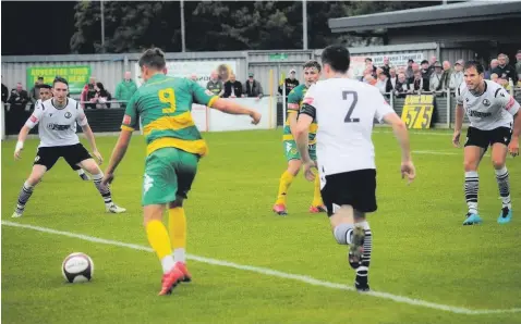  ?? Tom Paul ?? ● Ryan Brooke lining up his shot to score the second for Runcorn Linnets against Widnes