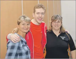  ?? KEVIN ADSHADE/THE NEWS ?? Daniel Martin is shown with coaches Angela Fogarty, at left, and Carla Dumaresq.